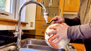 The Heavy Ball Method: Why Long Throw Coaches Use Weighted Footballs