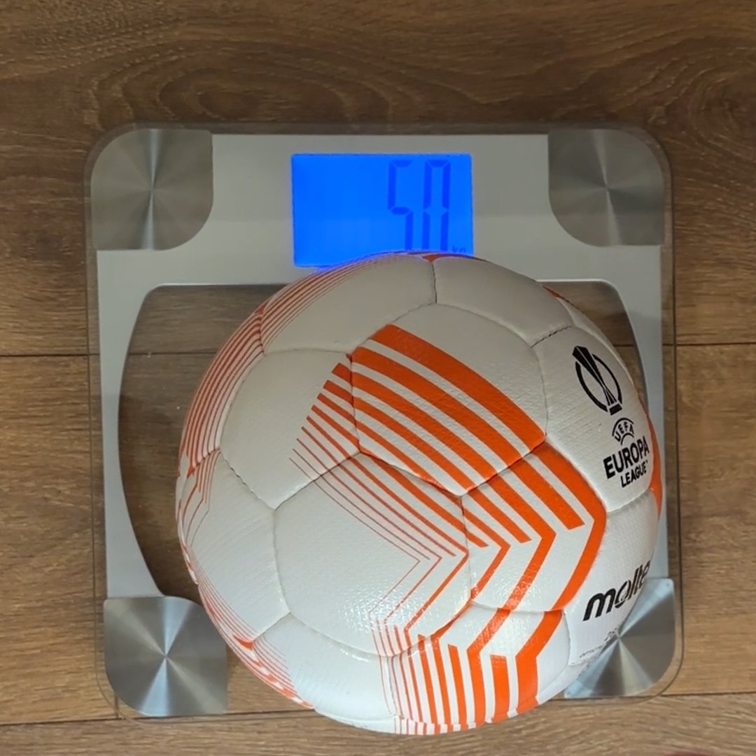 Long Throw Coach heavy ball on scales showing 5kg
